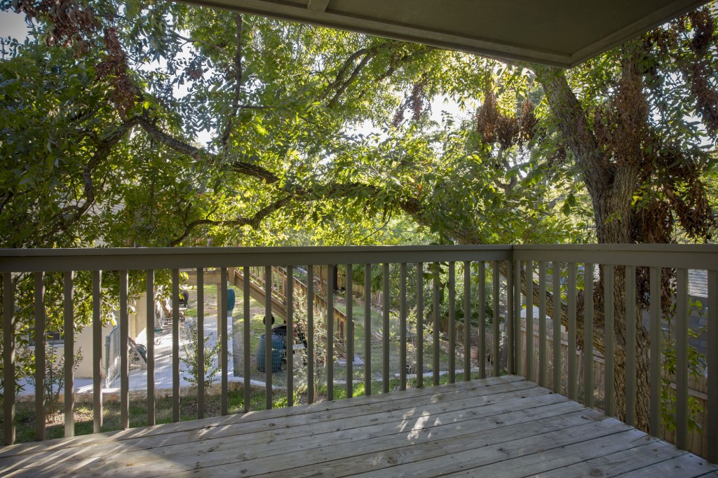 Balcony off Family Room under pecan tree. 