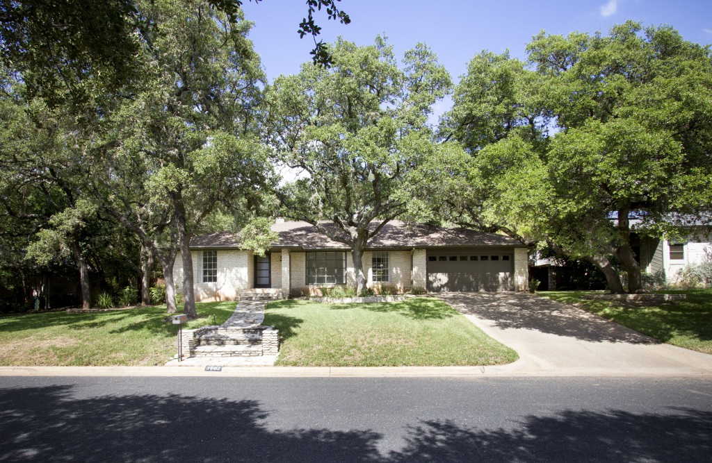 Front view of one story ranch remodeled home in Northwest Hills neighborhood of Austin.