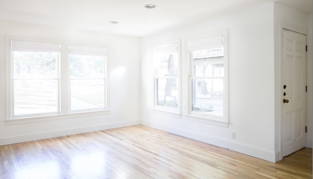 Tarrytown Home for lease Austin Tx. Living Room - Large wood windows, wood floors, white walls.