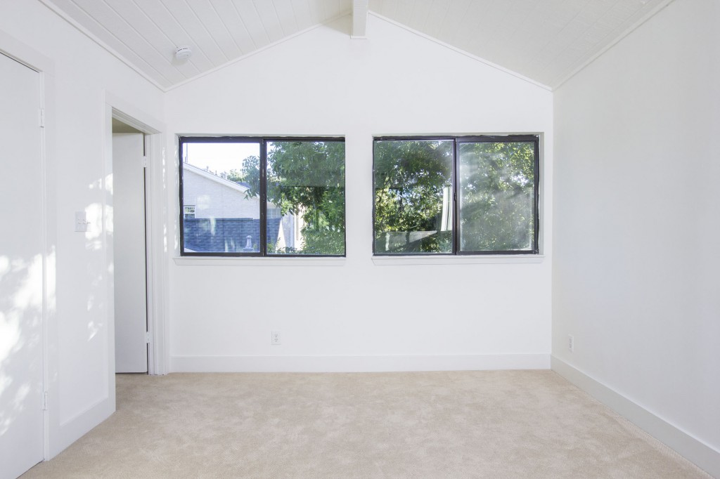 Master Bedroom is a private space upstairs with tree top views. 