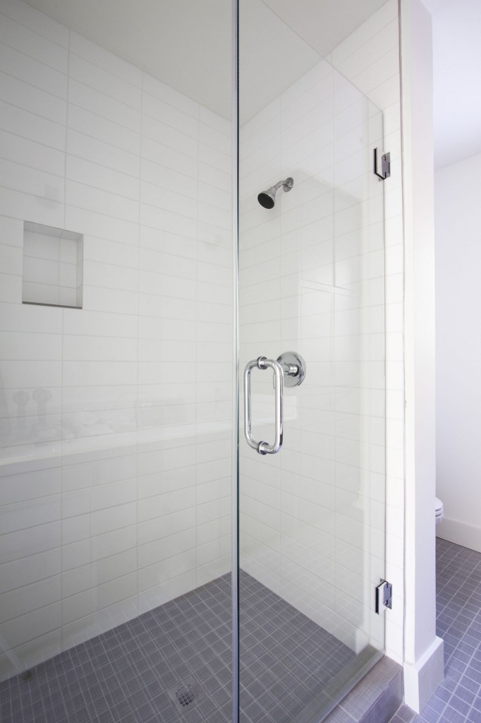 Master Bath has European glass shower with subway tile on walls.
