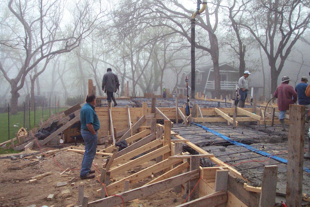 Concrete crew forming the foundation for new craftsman home. Austin craftsman foundation.
