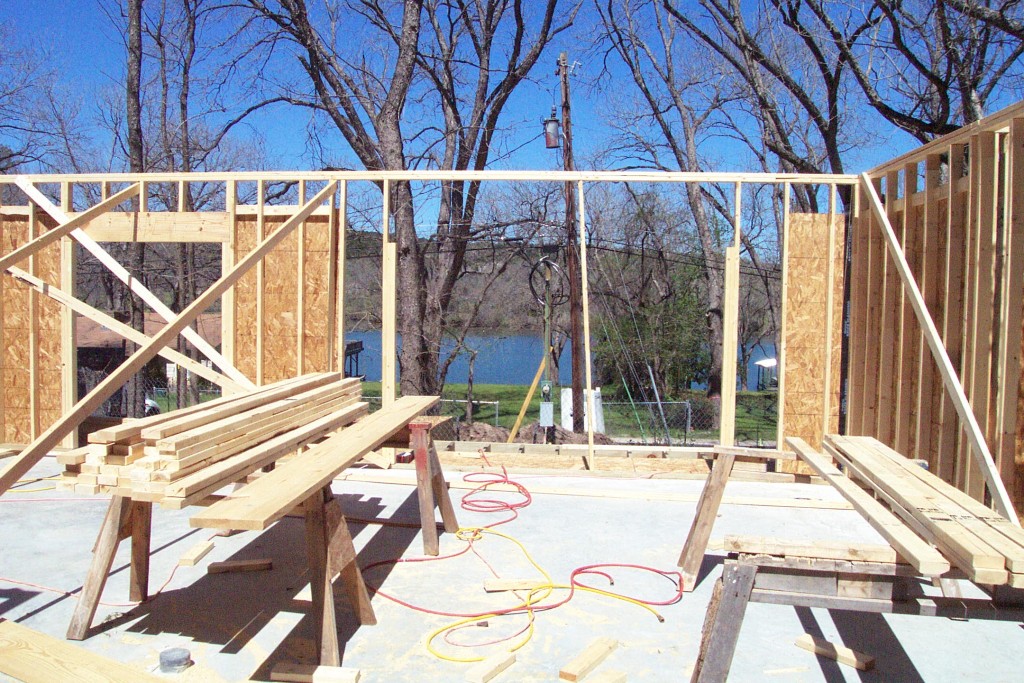 Framing stage shows living room windows taking shape. Look out to the view.