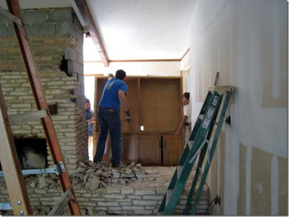 Ranch house remodel - View of demolition of fireplace and cabinets.