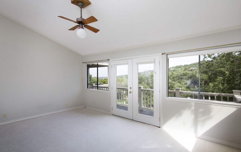 Master bedroom enjoys the lovely hill country views that Austin Westlake is known for.