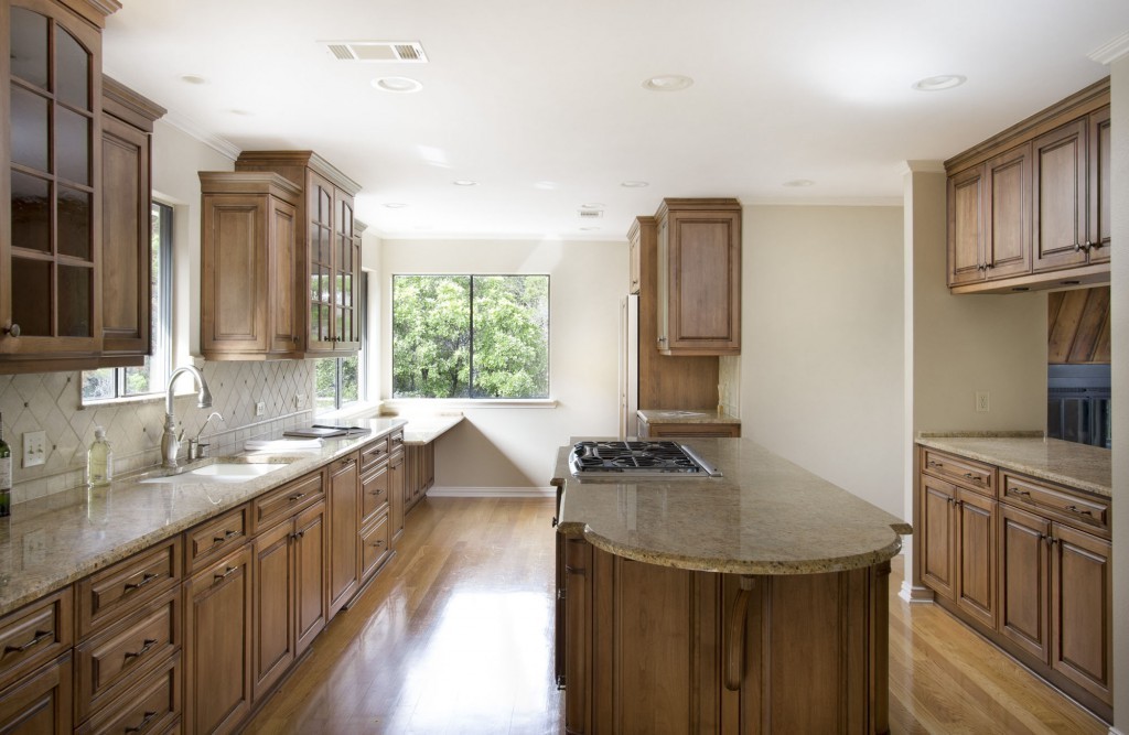 Updated kitchen: wood floors, granite, stainless appliances, custom cabinets.