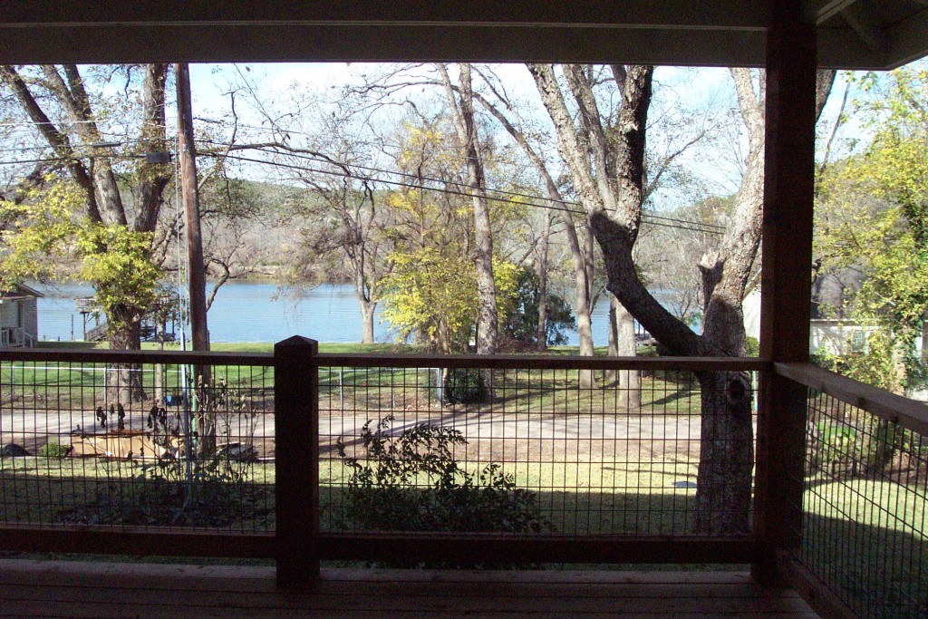 View of Lake Austin from front porch of Craftsman bungalow. 