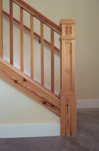 Antique reclaimed pine on newel posts of stairs.