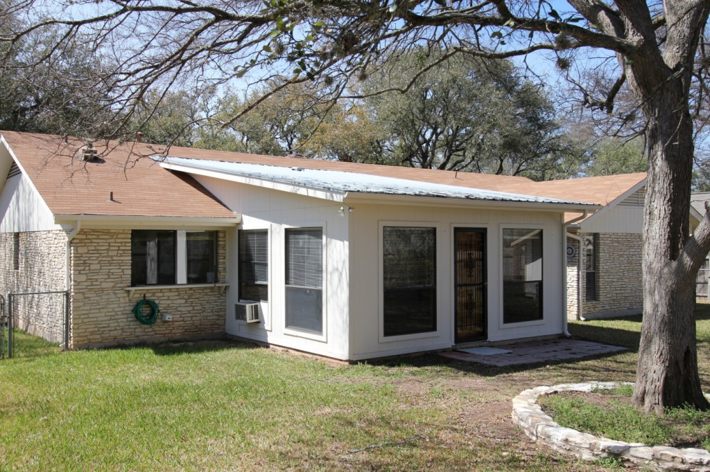 View of home before remodeling. Ranch house remodel Austin project.