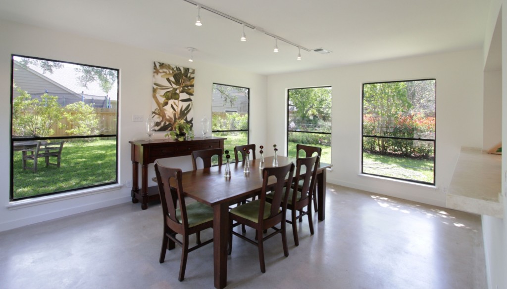 Dining After Remodel - View of lovely dining room surrounded by windows.