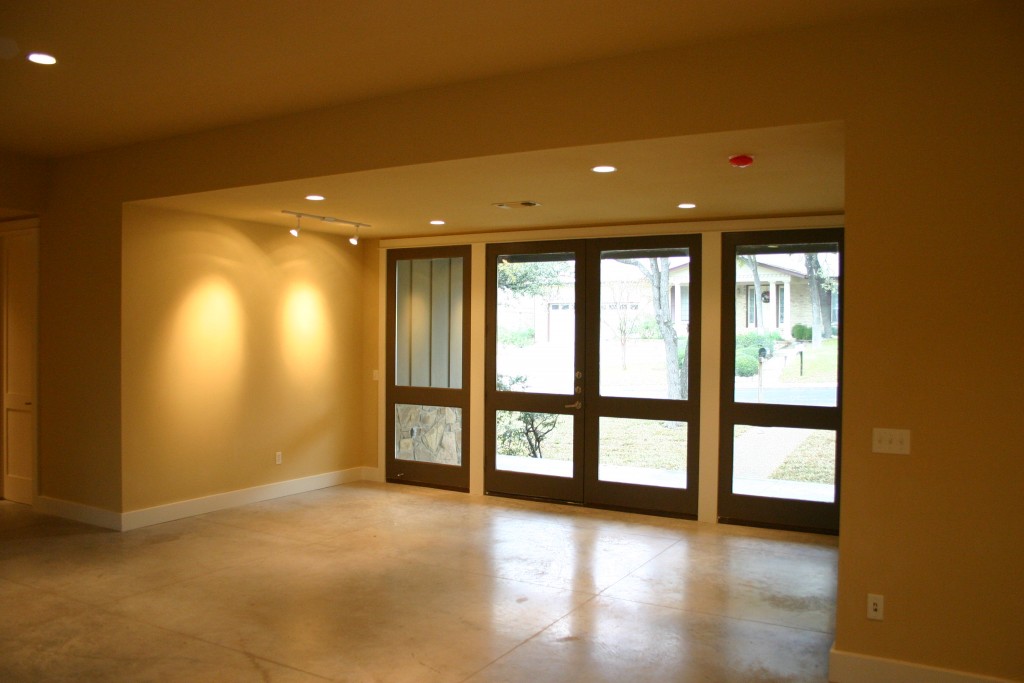 Modern Ranch House Austin. View of entry foyer with double glass doors.