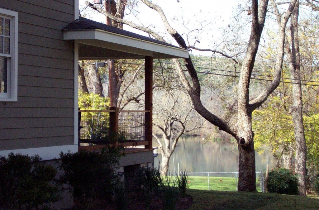 View of Lake Austin from side yard of Austin craftsman style house.