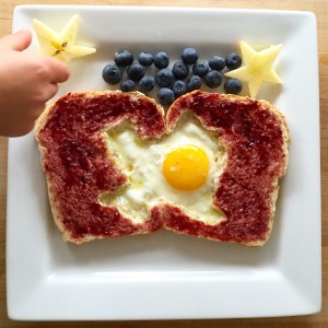 Fun photo of Texas shape cut into toast with and egg yoke at Austin location. 
