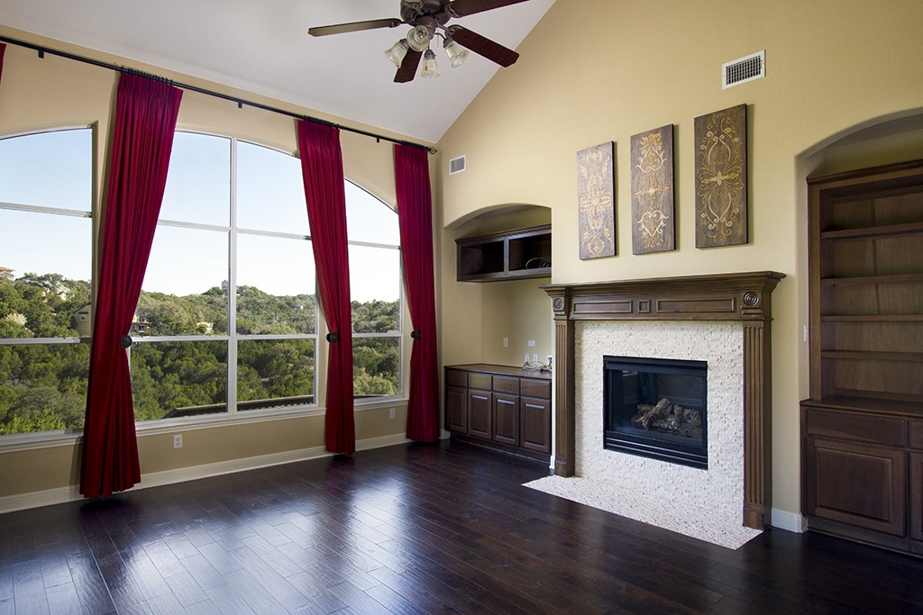 Austin home interiors - Family room with grand view of hill country through large windows.