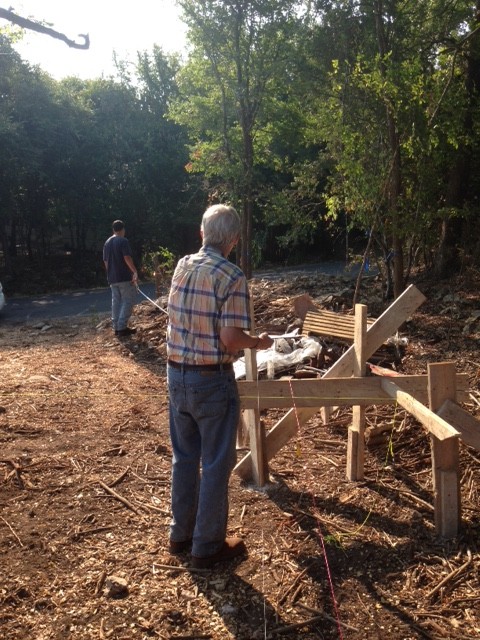 Jim and Matt pulling string to lay out foundation for modern farmhouse.