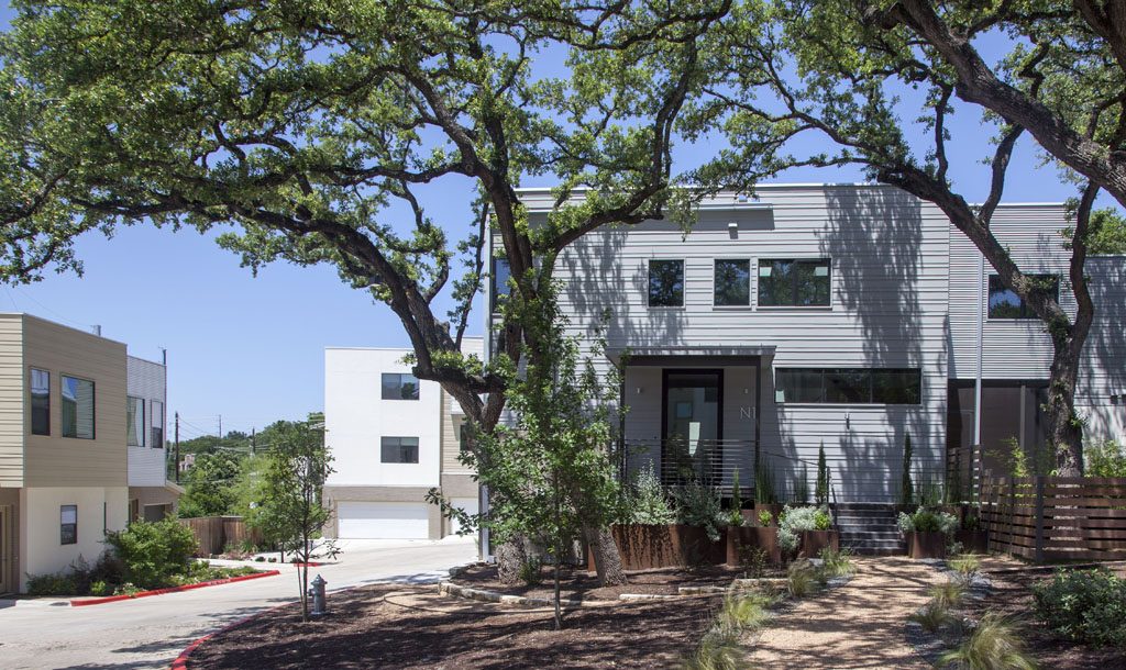  Cardinal Lane Condos built of of metal and stucco siding on rolling property in south Austin.