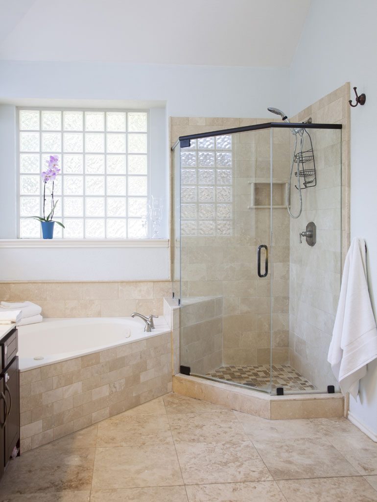 Updated master bath with European glass shower door.