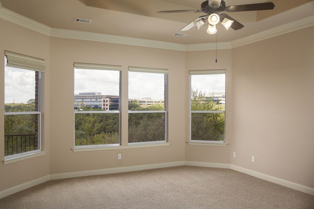 Master bedroom overlooking view at 6218 River Place home.